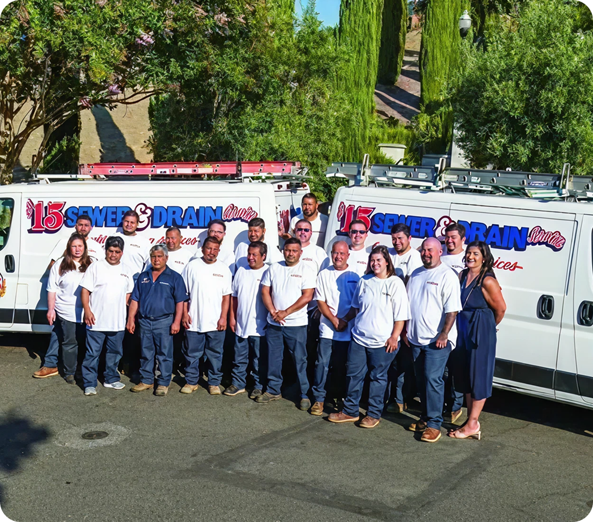 Group of people in uniforms by vans.