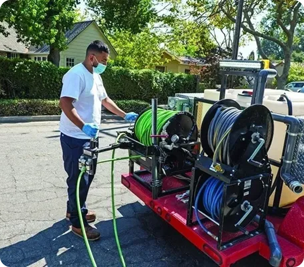 Technician handling outdoor hose system
