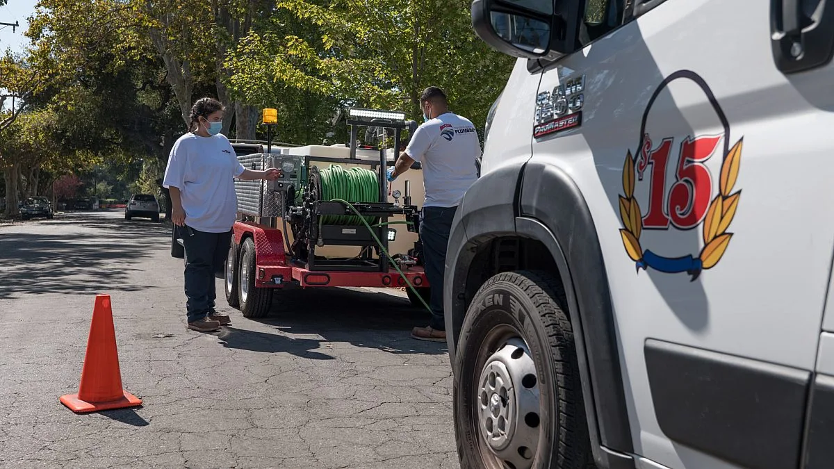 Men working near parked truck