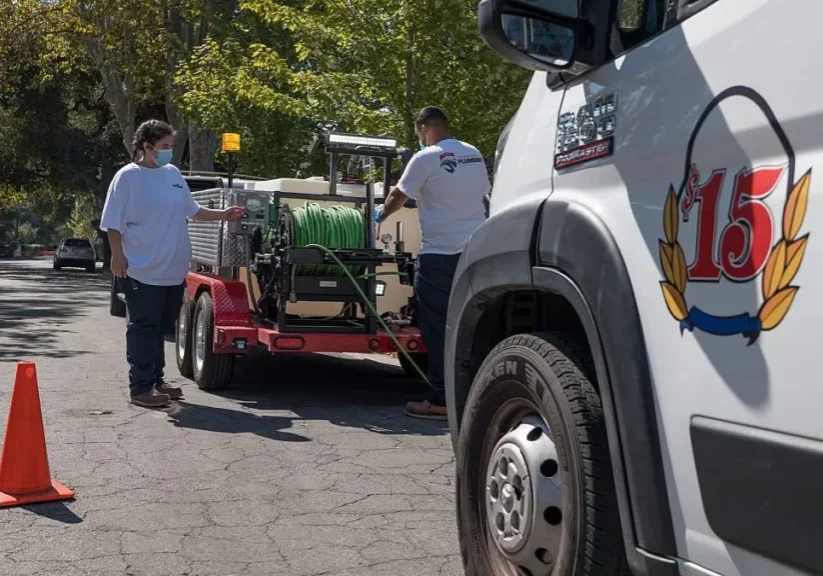 Men working near parked truck